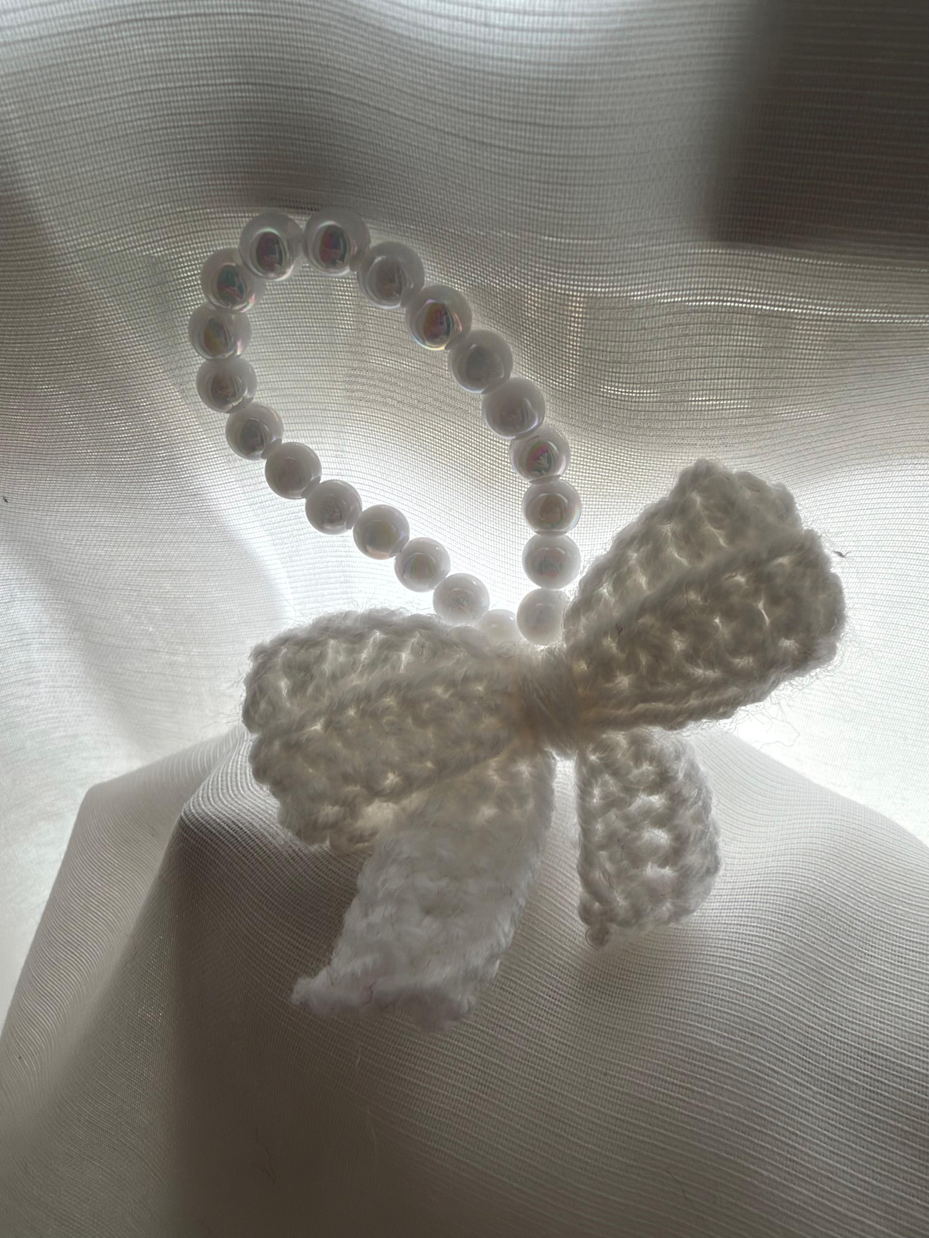 Accessorio a fiocco con perline